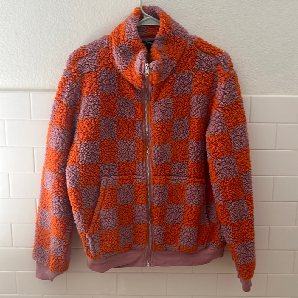 Pink and orange checkerboard, print fleece zip up jacket